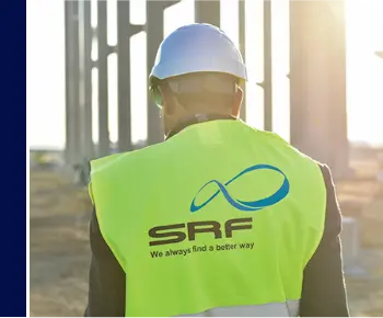 SRF Employee with a green vest having SRF logo